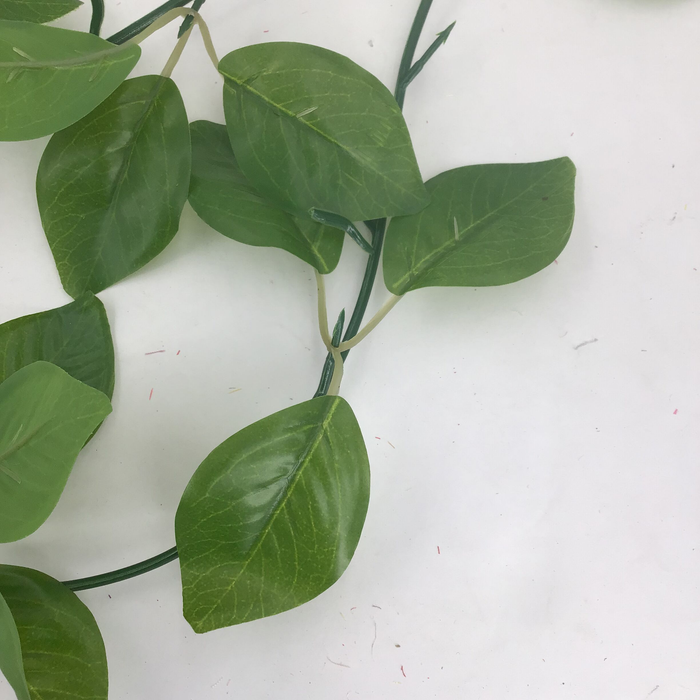 Artificial green leaves on a white background