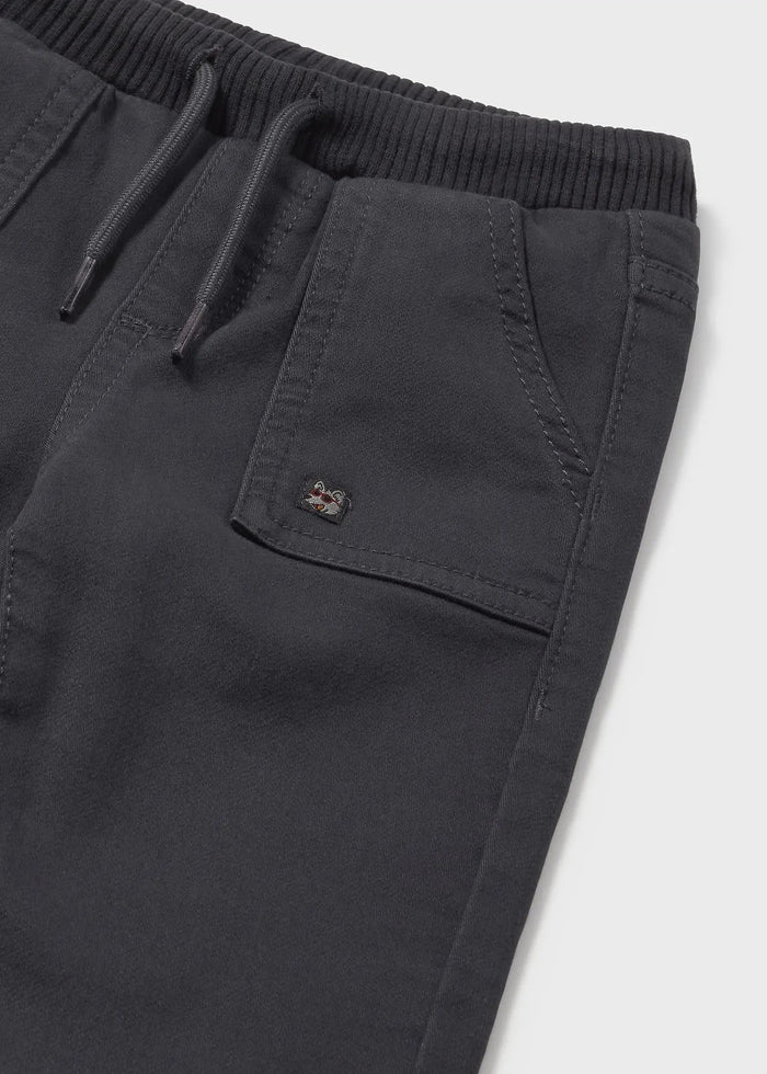 Closeup of Mayoral baby joggers showing back pocket detail, twill fabric, and waistband.