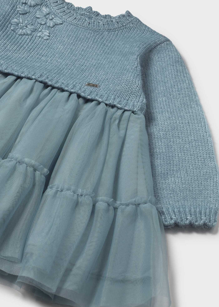 Closeup of Mayoral baby tulle dress showing applique detail, lined skirt, and soft Blue-Green fabric.