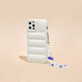 White quilted phone case with a beaded Crystal Evil Eye strap, shown on a beige background.