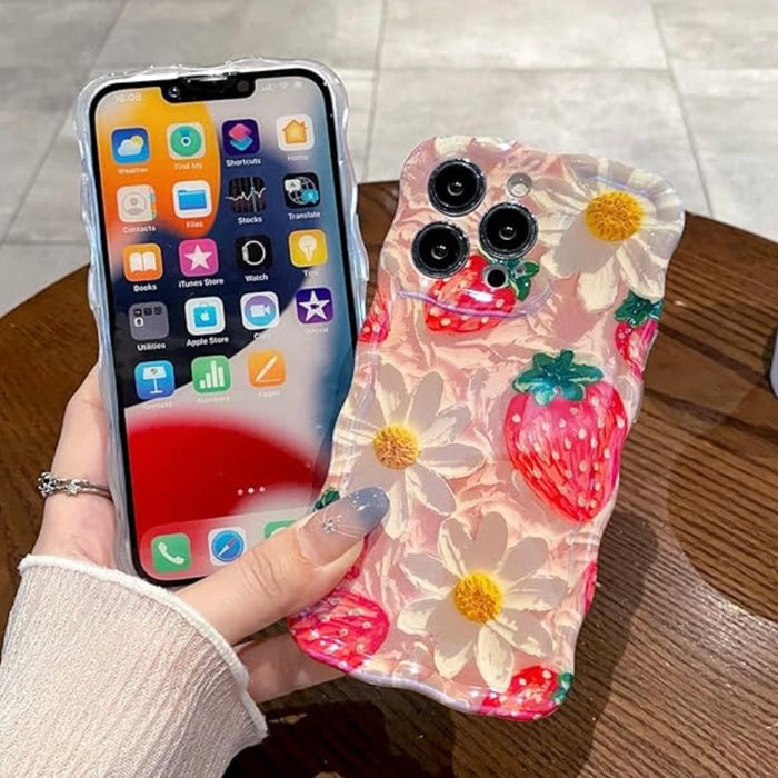 Pink wavy iPhone case featuring painted style red strawberries and white daisies with yellow centers.
