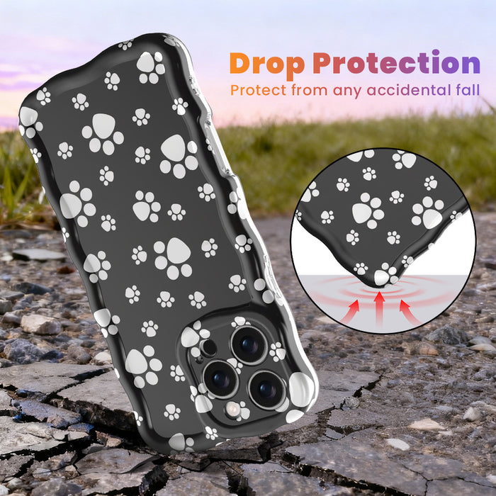 Black wavy iPhone case featuring a pattern of white paw prints held in hand, showing glossy finish.