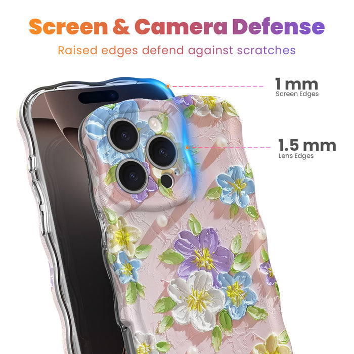 Soft pink wavy iPhone case featuring painterly flowers in purple, blue, and yellow with a glossy finish.
