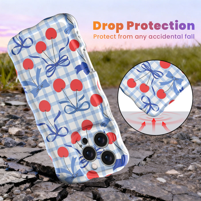 Blue and white gingham iPhone case featuring red cherries and blue ribbon bows with wavy edges.