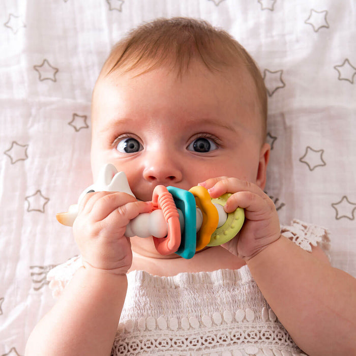 baby teething on colo rings