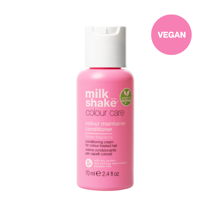 Pink bottle of milk_shake colour care conditioner on a white background