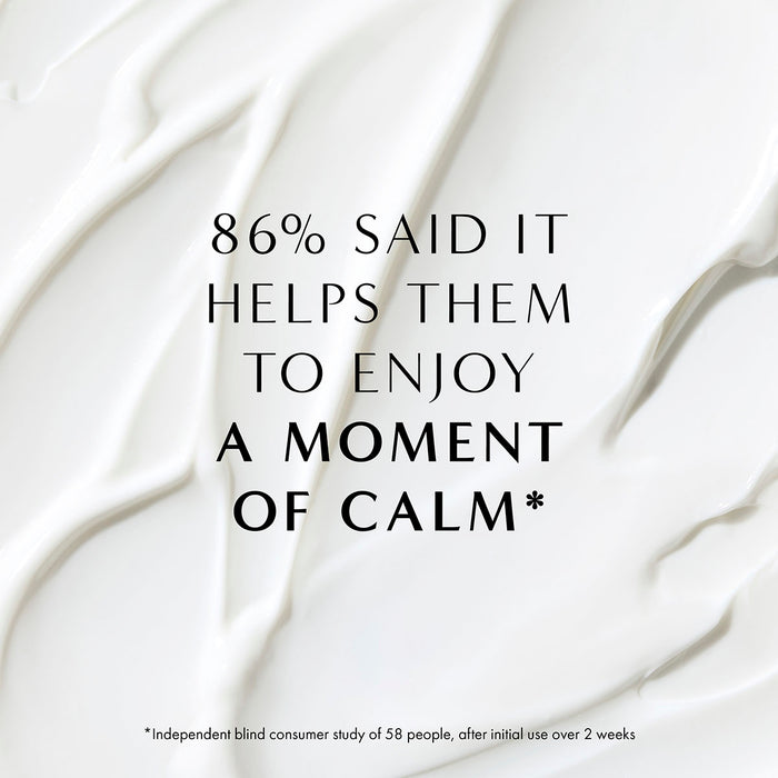 Cream texture background with text highlighting calming benefits of NEOM Complete Bliss hand lotion