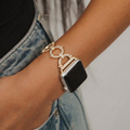 girl wearing diamante bracelet watch strap on her wrist in jean pocket
