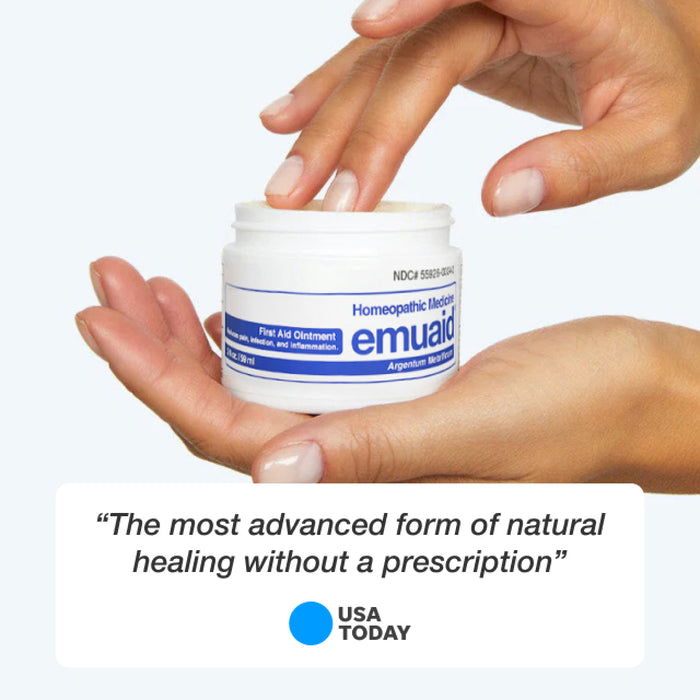hands holding emu aid ointment toggler