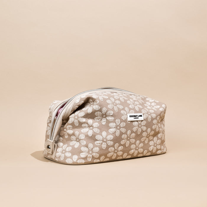 Expandable makeup bag with mocha brown floral pattern from Coconut Lane.