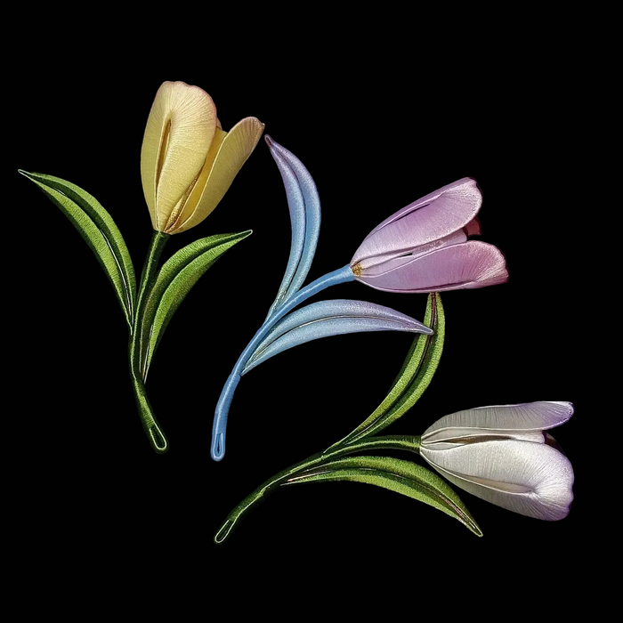 Three handcrafted Chanhua tulip brooches in yellow, purple, and white with gradient thread-wrapped petals.