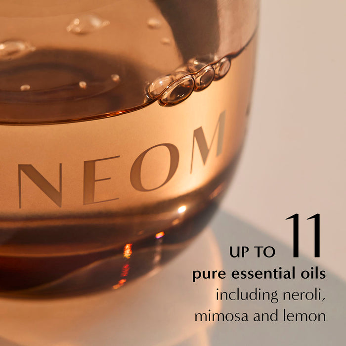 NEOM diffuser oil close-up highlighting 11 essential oils including neroli, mimosa and lemon