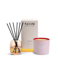 NEOM Happiness reed diffuser and it's all rosy 3 wick candle on a white background