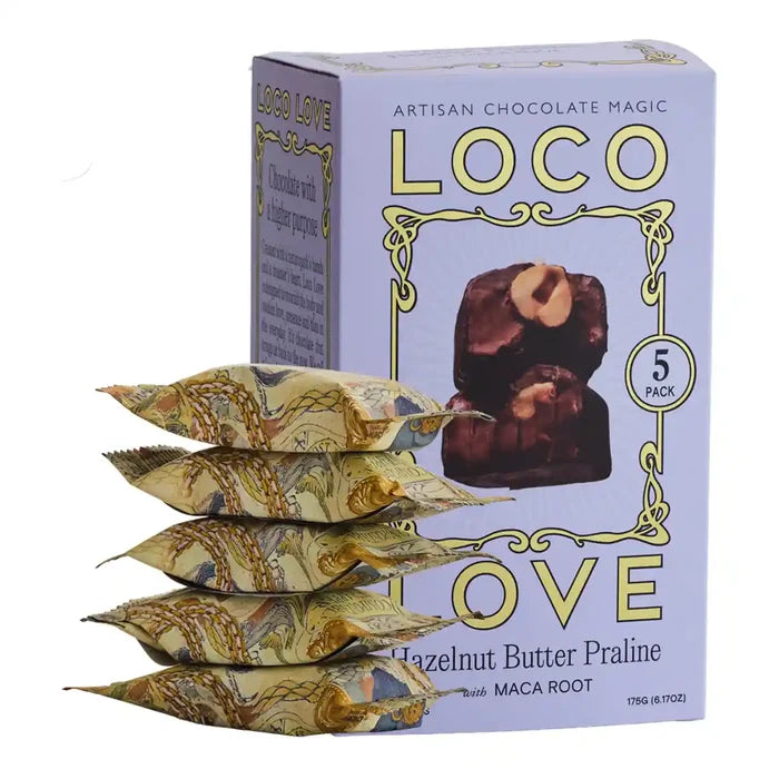 Stack of Loco Love hazelnut butter pralines with packaging on a white background