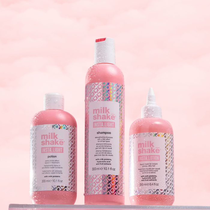 Three bottles of milk_shake INSTA.LIGHT hair care products on a pink background