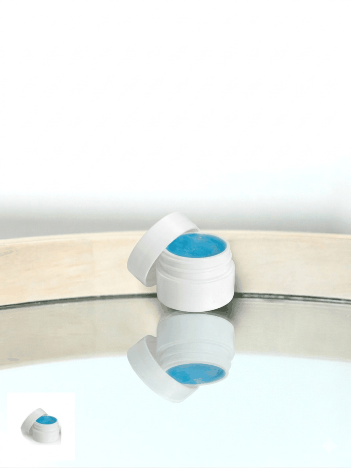 Jar lip balm in a small clear container with natural peppermint ingredients for moisturizing and protecting lips
