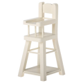 White wooden high chair on a white background