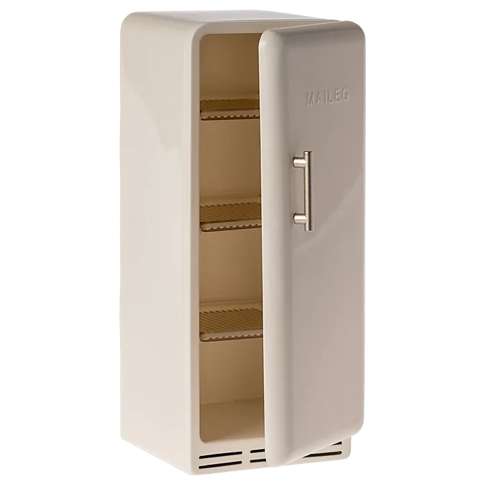 Beige refrigerator with open door on a white background