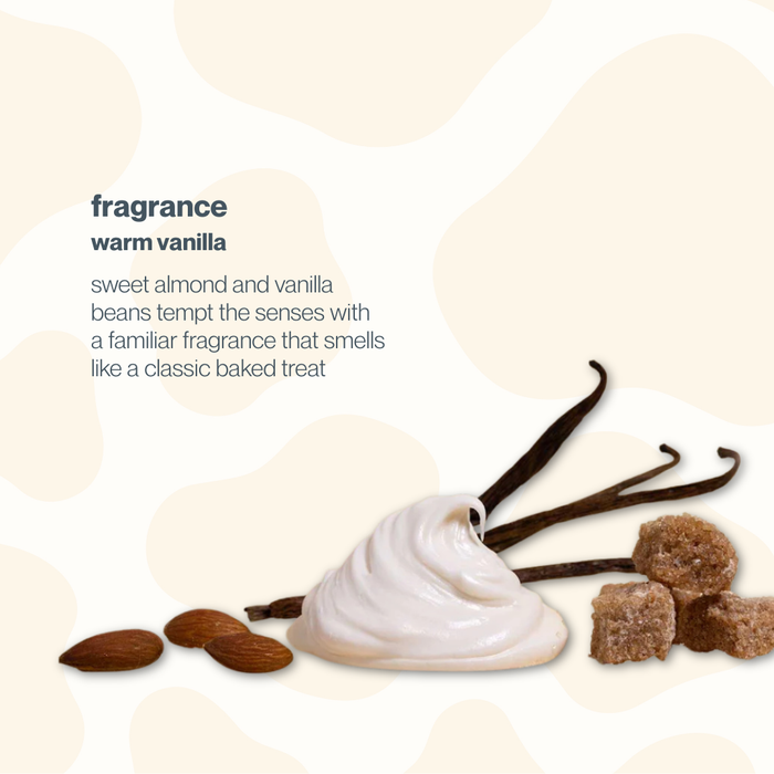 Advertisement for a warm vanilla fragrance with vanilla beans, almond, and brown sugar on a beige background.