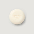 Cream-colored Carmina Perfumed Soap bar, embossed CREED 1760 logo, top view | Creed Boutique