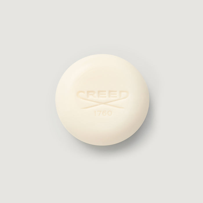 Cream-colored Carmina Perfumed Soap bar, embossed CREED 1760 logo, top view | Creed Boutique