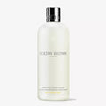 Molton Brown Purifying Conditioner bottle on a white background