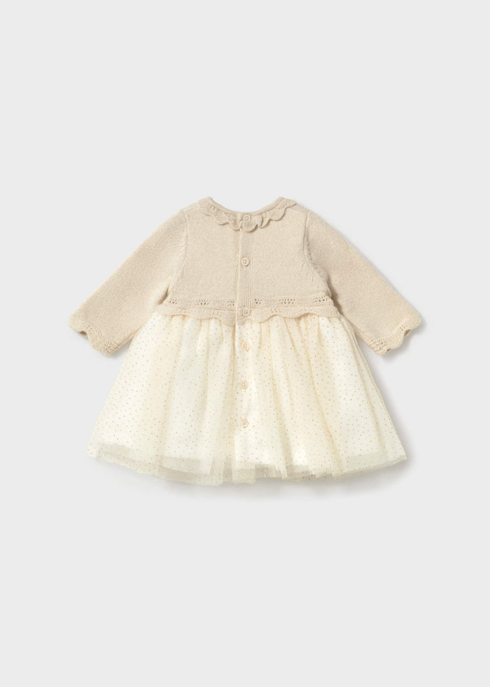 Back view of Mayoral newborn girl Ivory tulle dress with soft layered skirt and long sleeves.
