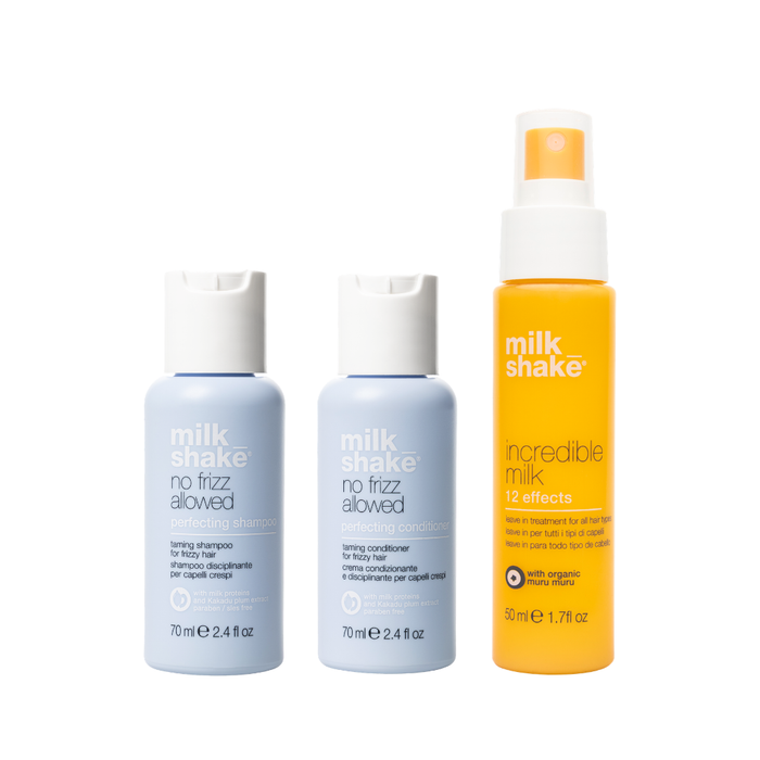 Three bottles of milk shake hair care products on a white background no frizz allowed, incredible milk