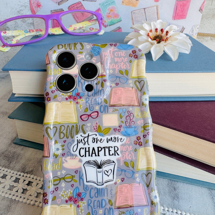 One More Chapter MagSafe iPhone case with books, reading glasses, and book quotes by Fancy Bands