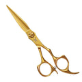 Gold scissors on a white background