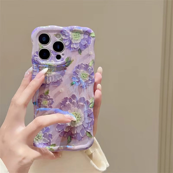 Lavender wavy iPhone case featuring large painterly purple flowers with green centers and leaves.
