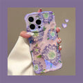 Lavender wavy iPhone case featuring large painterly purple flowers with green centers and leaves.