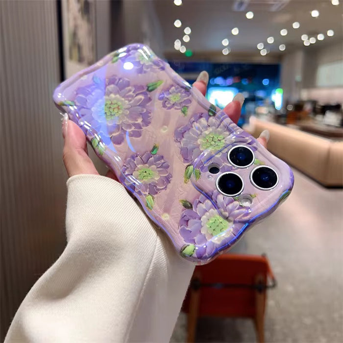 Lavender wavy iPhone case featuring large painterly purple flowers with green centers and leaves.