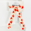 Cream satin ribbon bow hair clip with red floral print by Coconut Lane.