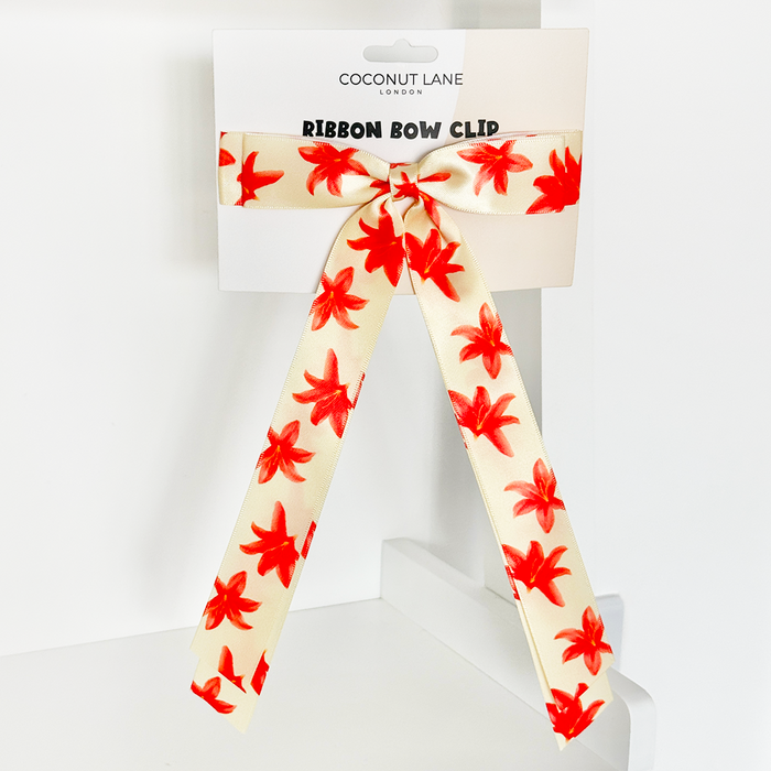 Cream satin ribbon bow hair clip with red floral print by Coconut Lane.