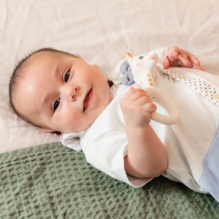 baby with teething ring from sophie la giraffe