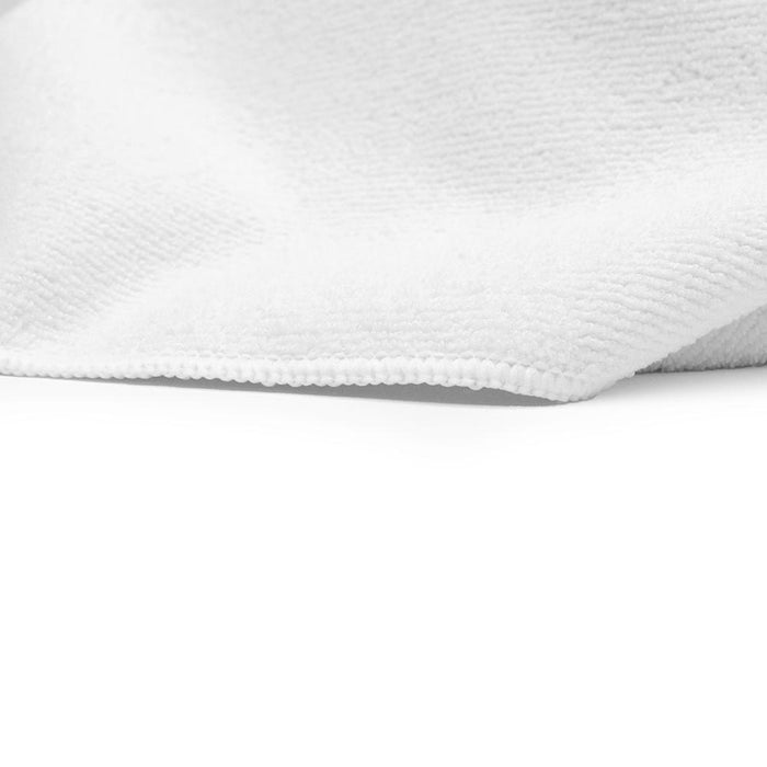 The Rag Company Spa and Workout white towel close up on a white background.