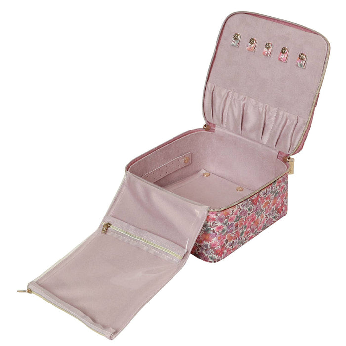 Pink jewelry case with floral pattern and open lid on a white background