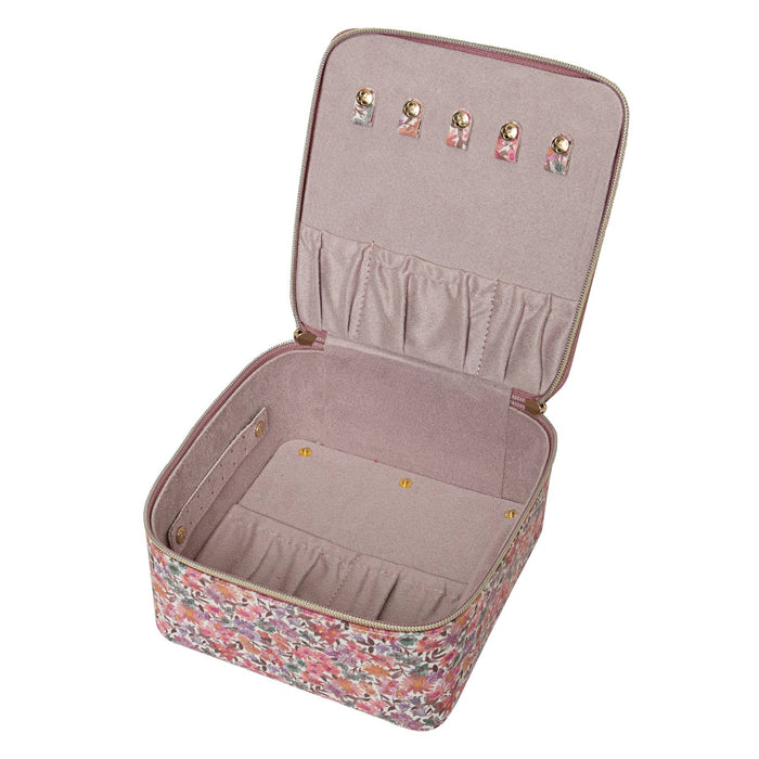 Open jewelry case with floral pattern on a white background