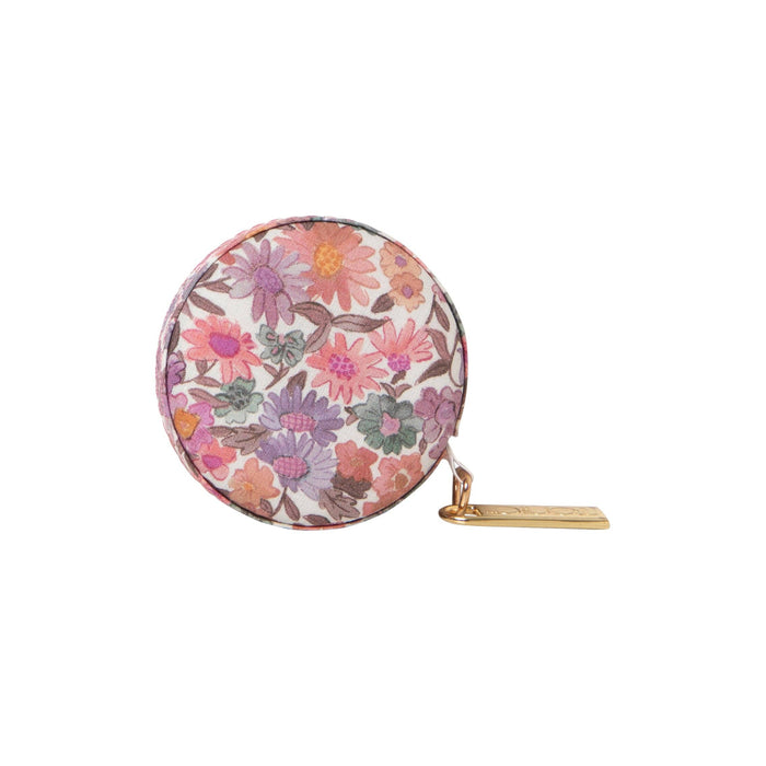 Round floral-patternedmeasuring tapeon a white background