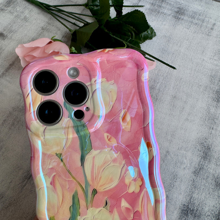 Pink wavy iPhone case featuring painterly white and pink tulips with green stems and iridescent finish.