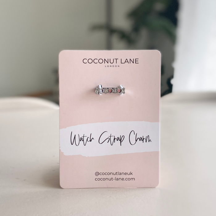 Silver crystal heart watch strap charm by Coconut Lane, displayed on a pink card labeled Watch Strap Charm.